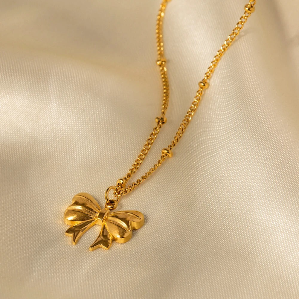 Élodie Lavin® | Collier doré pendentif nœud romantique