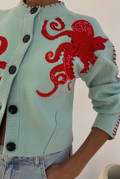 Cardigan côtier en maille confortable avec motif pieuvre et bordure contrastée
