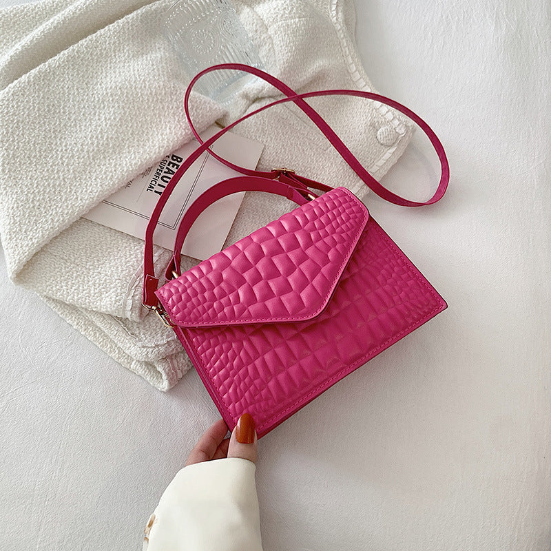 Sac à main à rabat en cuir texturé