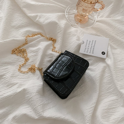 Sac à bandoulière en cuir texturé brillant