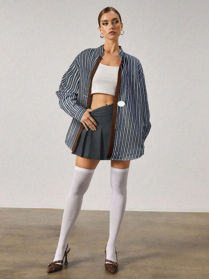 Chemise longue à rayures avec fermeture en métal