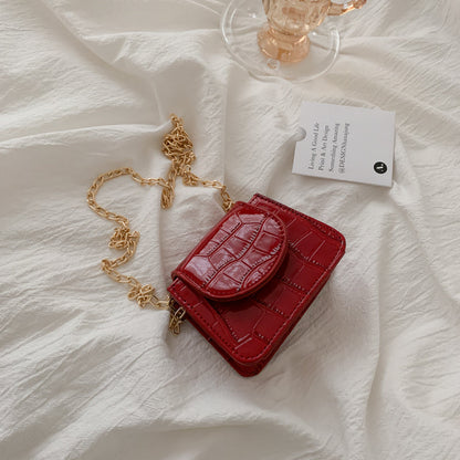 Sac à bandoulière en cuir texturé brillant