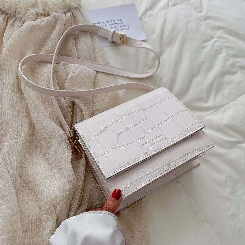 Sac à bandoulière en cuir texturé