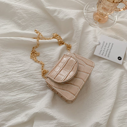 Sac à bandoulière en cuir texturé brillant