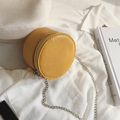 Petit sac à bandoulière en cuir  texturé rond ou carré