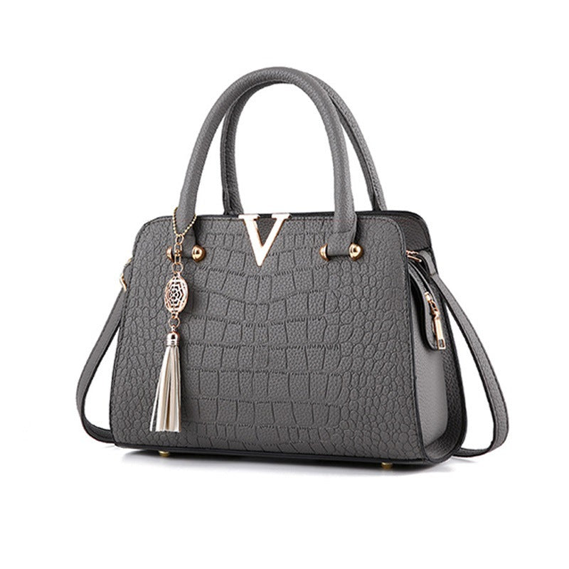 Sac à Main Élégant à Motif Texturé avec Pendentif Décoratif
