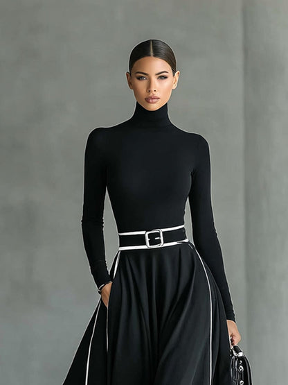 Robe longue noire col montant manches longues ceinturée avec surpiqûres