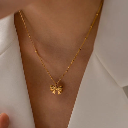 Élodie Lavin® | Collier doré pendentif nœud romantique