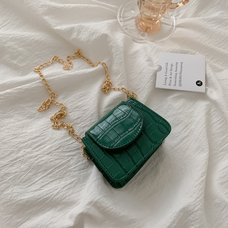 Sac à bandoulière en cuir texturé brillant