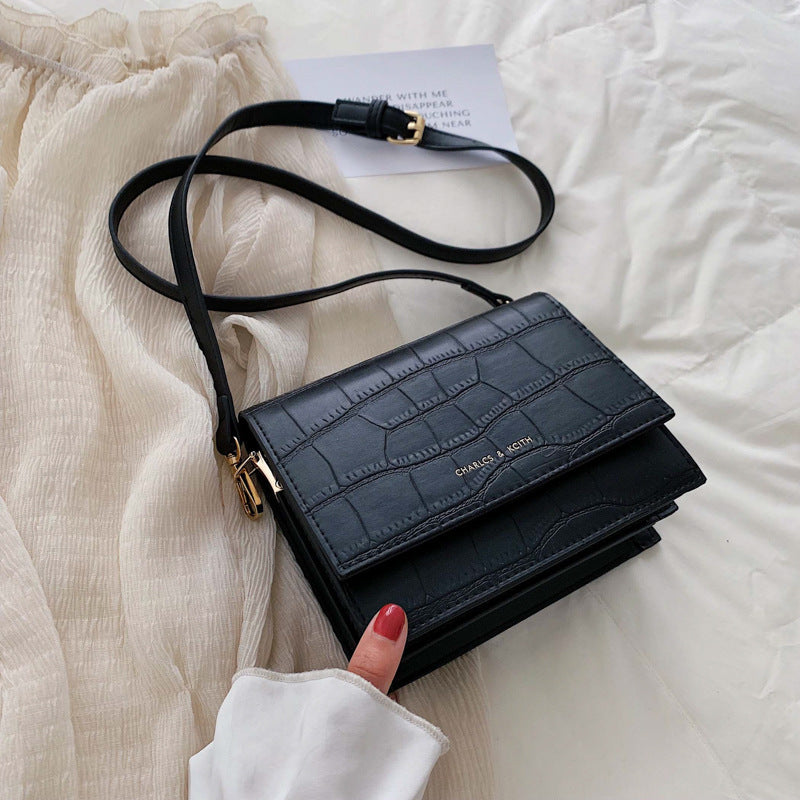 Sac à bandoulière en cuir texturé