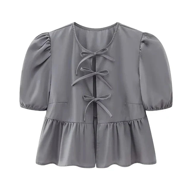 Blouse à manches bouffantes imprimé léopard avec détail nœud