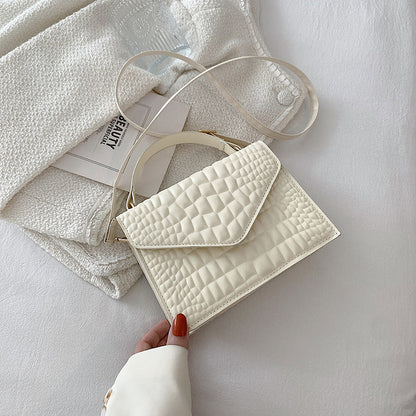 Sac à main à rabat en cuir texturé