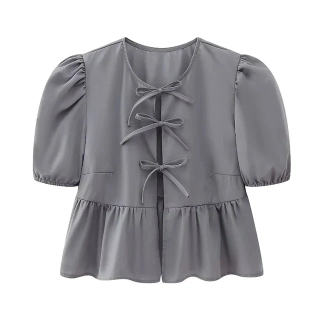 Blouse à manches bouffantes imprimé léopard avec détail nœud