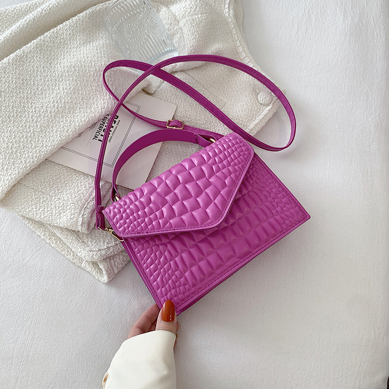 Sac à main à rabat en cuir texturé