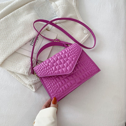 Sac à main à rabat en cuir texturé