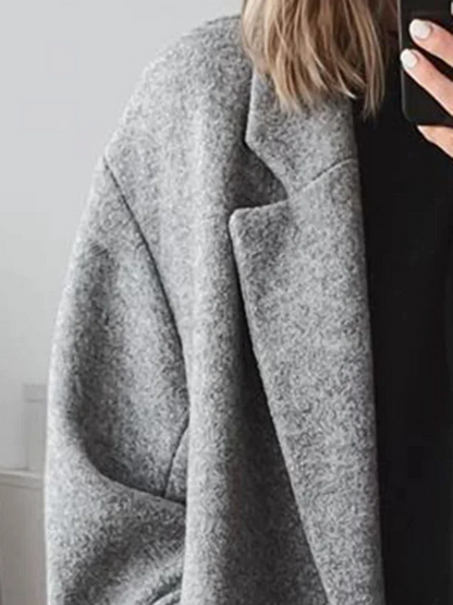 Manteau élégant long ample à double boutonnière