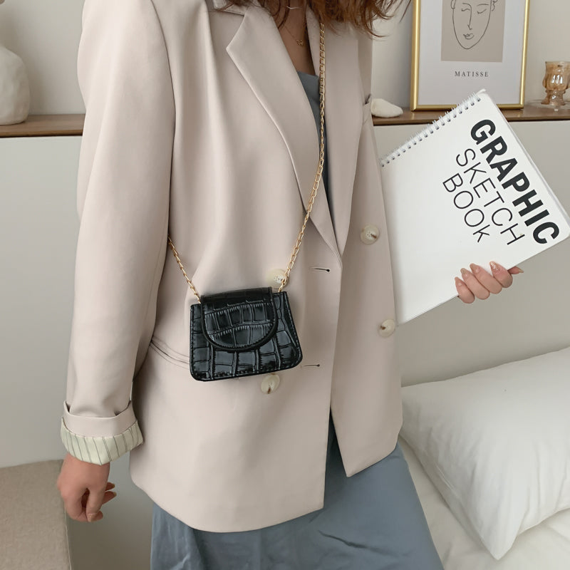 Sac à bandoulière en cuir texturé brillant