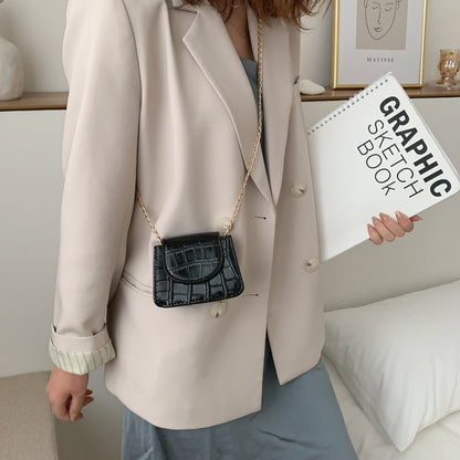 Sac à bandoulière en cuir texturé brillant