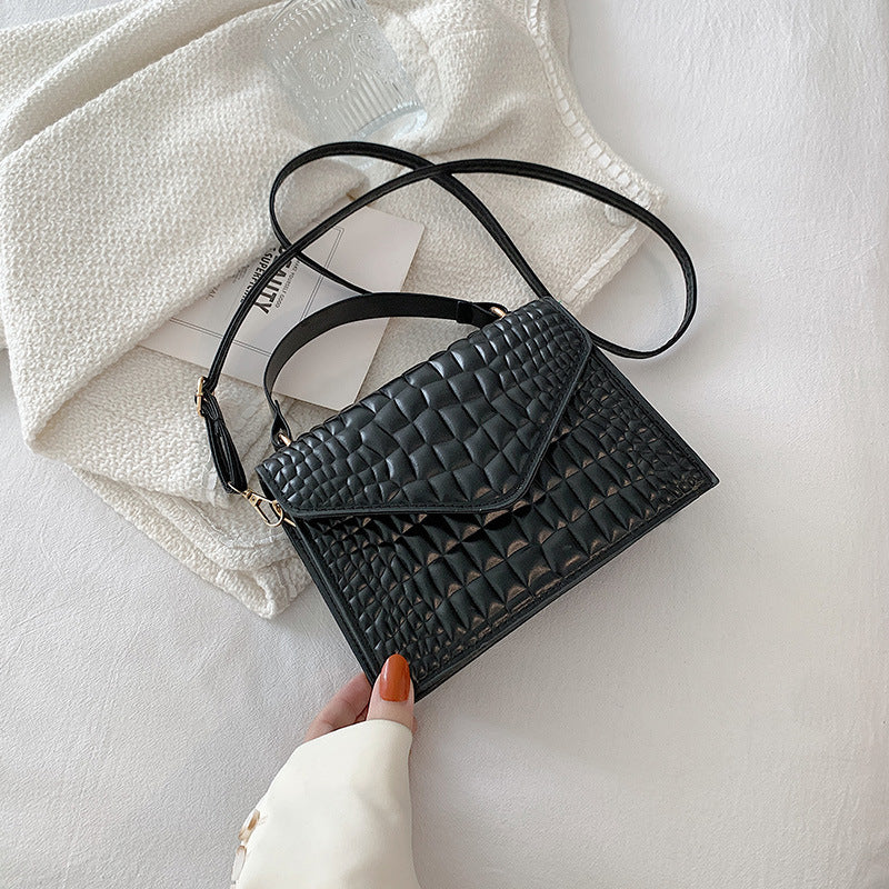Sac à main à rabat en cuir texturé