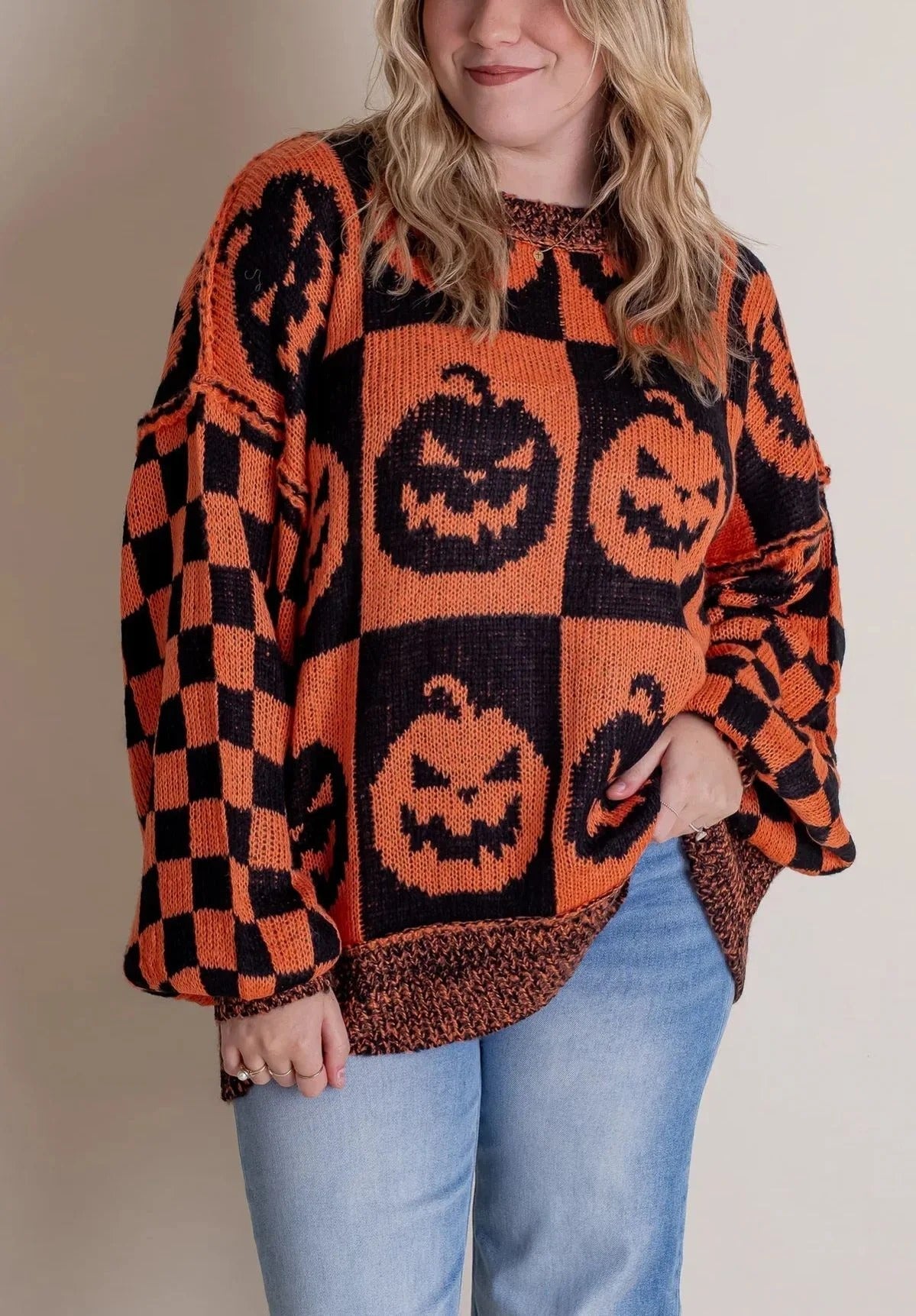 Pull en tricot à carreaux d'Halloween