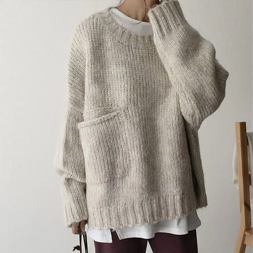 Pull oversized ivoire avec poches frontales