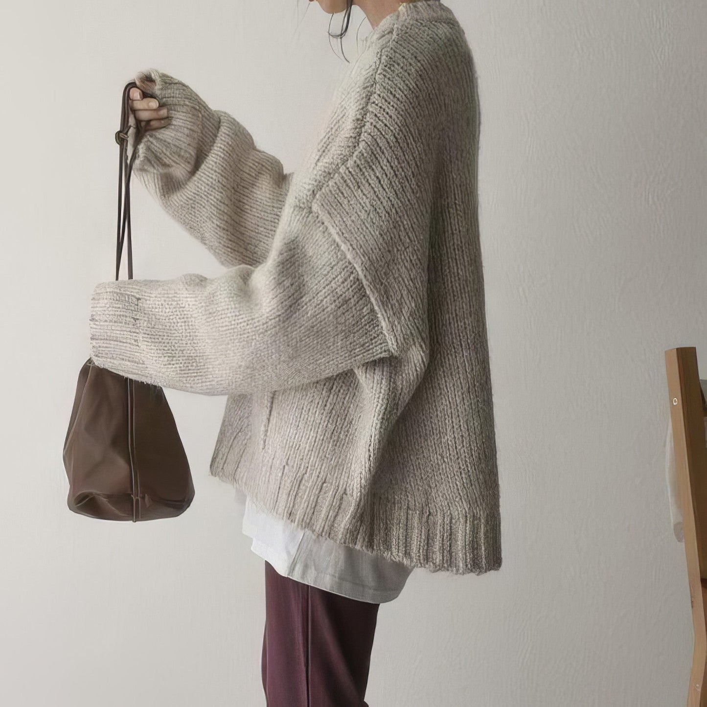 Pull oversized ivoire avec poches frontales